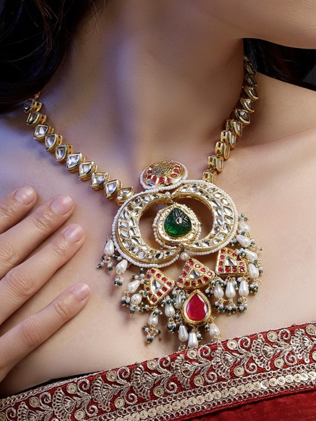 Multi shaped Kundan Necklace with Green Carved Stone and small Pearl hangings