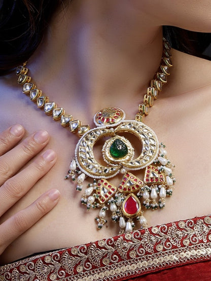 Multi shaped Kundan Necklace with Green Carved Stone and small Pearl hangings