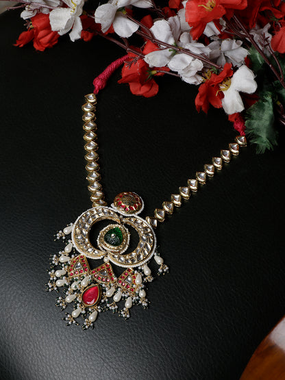 Multi shaped Kundan Necklace with Green Carved Stone and small Pearl hangings