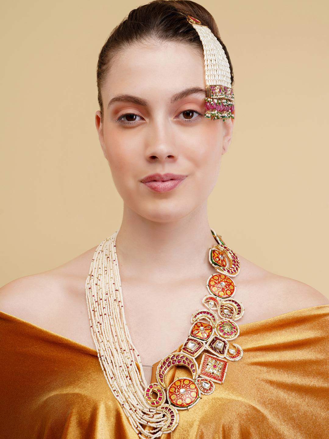 Designer necklace woith meenakari tikras alsong with kundan tikras joined togather with pearls strings