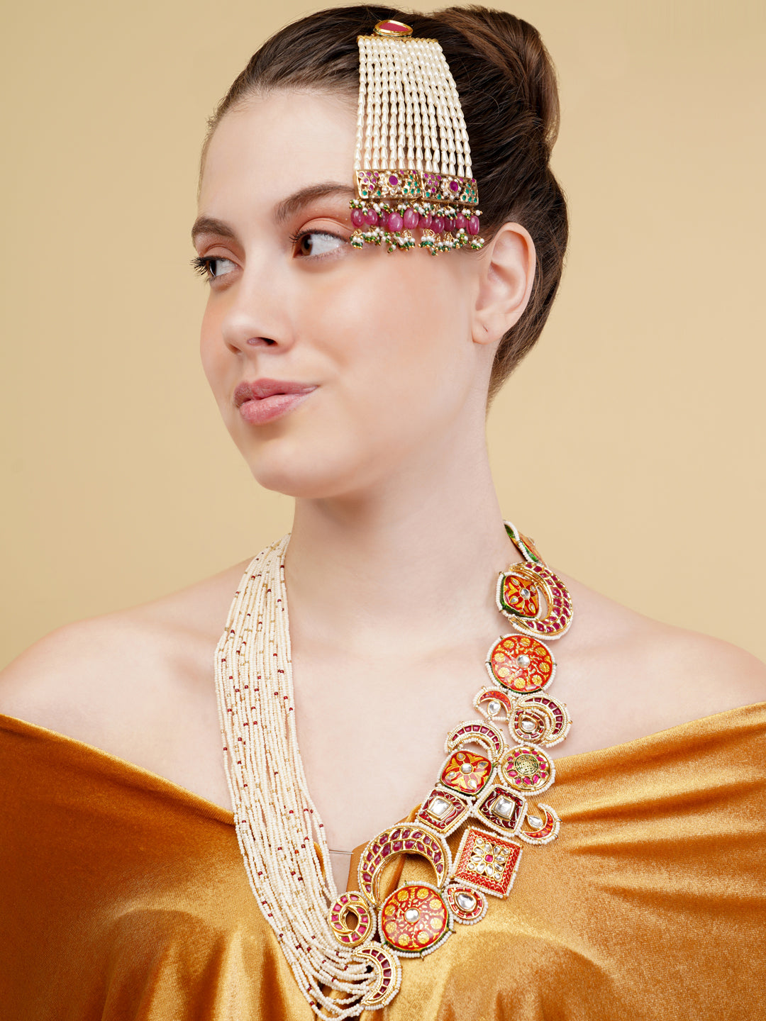 Designer necklace woith meenakari tikras alsong with kundan tikras joined togather with pearls strings