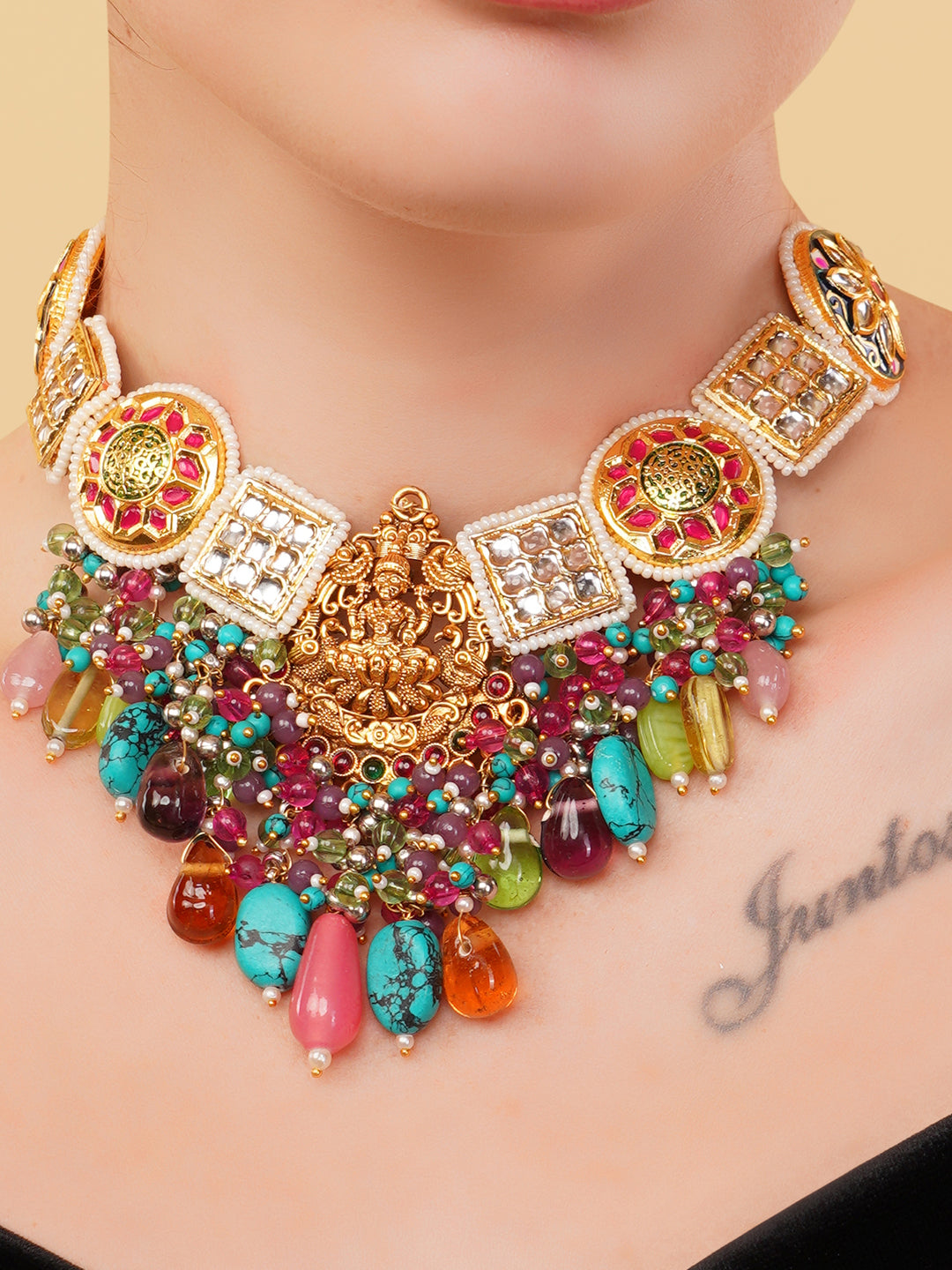 Temple Necklace with kundan tikras and mouthful of hangings to give a wholesome look