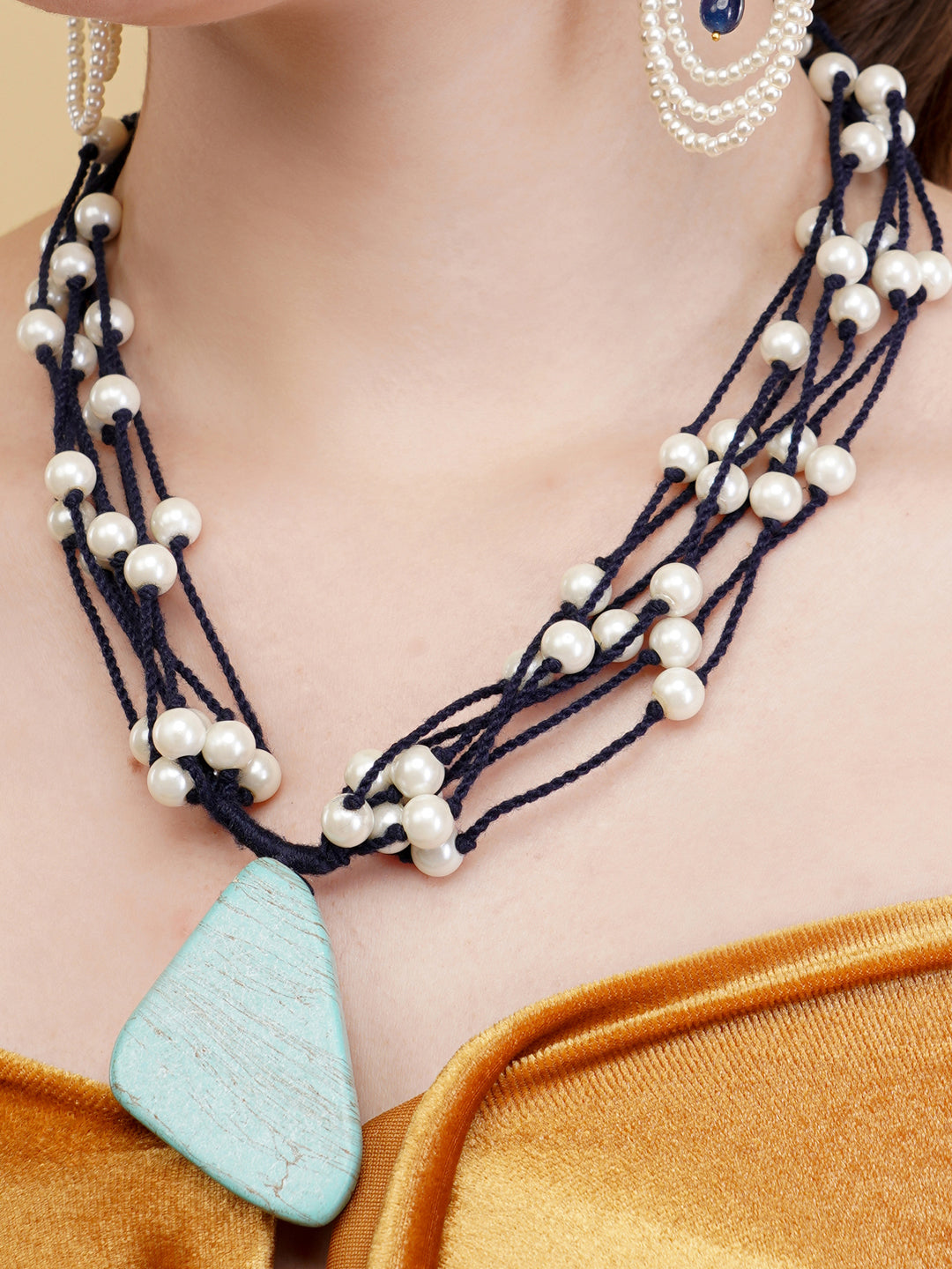 Pearls in thread necklace with natural stone hanging as a locket with adjustable chain
